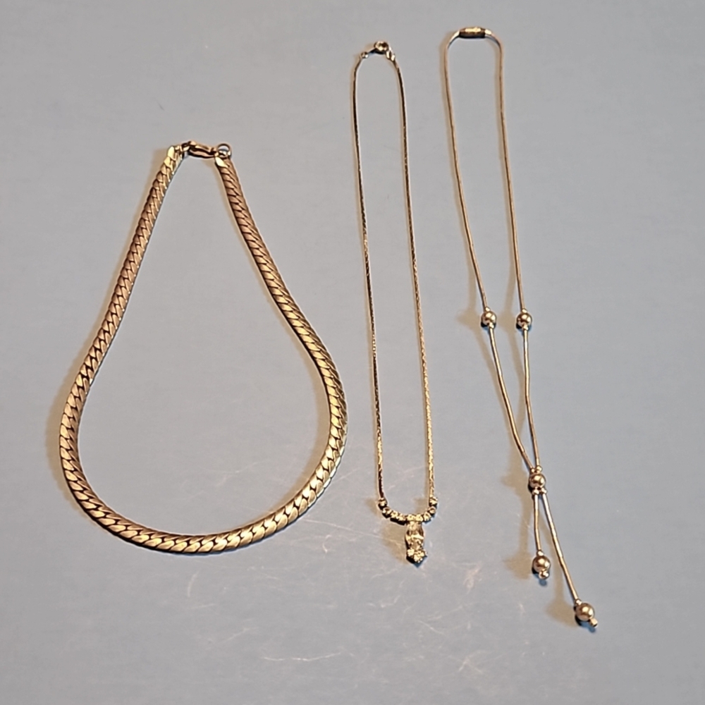 Three silver necklaces